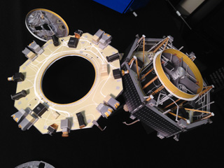 1:16 card scale model of an MMS spacecraft with exposed instrument deck.