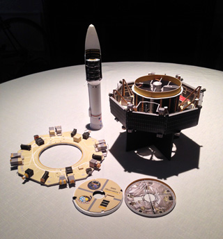 1:16 card scale model of the an MMS spacecraft and 1:96 card scale model of the payload fairing with a stack of 4 MMS spacecraft inside.