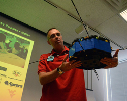Morgantown West Virginia Area RoboticS (MARS) organization lead Dr. Earl Scime holds the large LEGO model of NASA's Magnetosperic Multiscale Mission spacecraft that his students built. It was presented to the MMS team on Sept. 11, 2012.