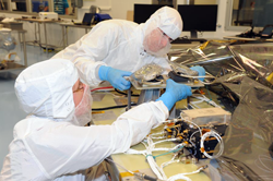 MMS Engineers install the Optical Bench Assemblies (OBA) onto spacecraft deck #1.